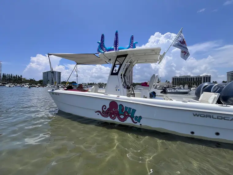 The Lulu anchored at a Boca Raton sandbar with guests relaxing aboard